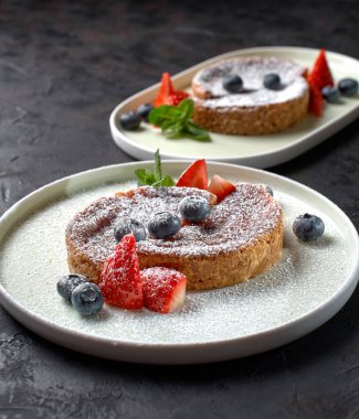 Crack Pie, American dessert with a rich salty-sweet taste on an oatmeal basis, on a black stone background. Banner