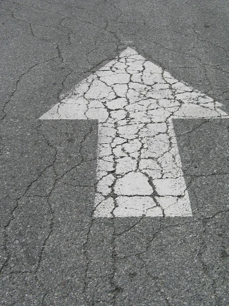 Painted arrow on pavement — Stock Photo, Image