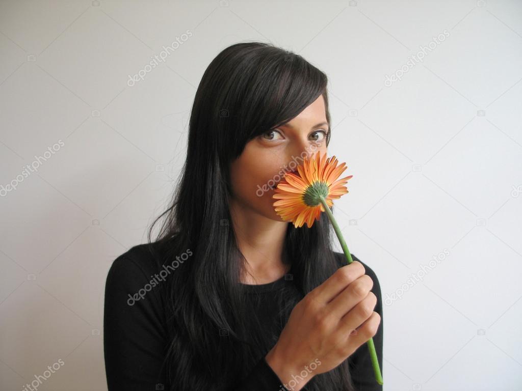 Playful Young Woman With Flower
