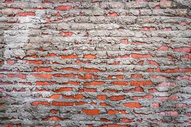 Grunge kırmızı tuğla ve gri beton duvar arka planı. Betonlu eski tuğla duvar. 