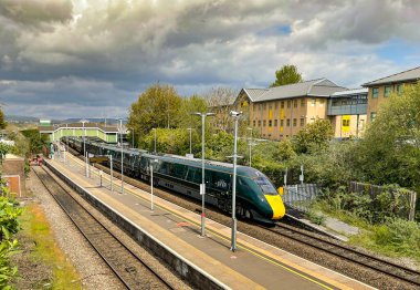 Bridgend, Wales - April 2021: Class 800 diesel electric high speed train departing Bridgend railway station for London clipart