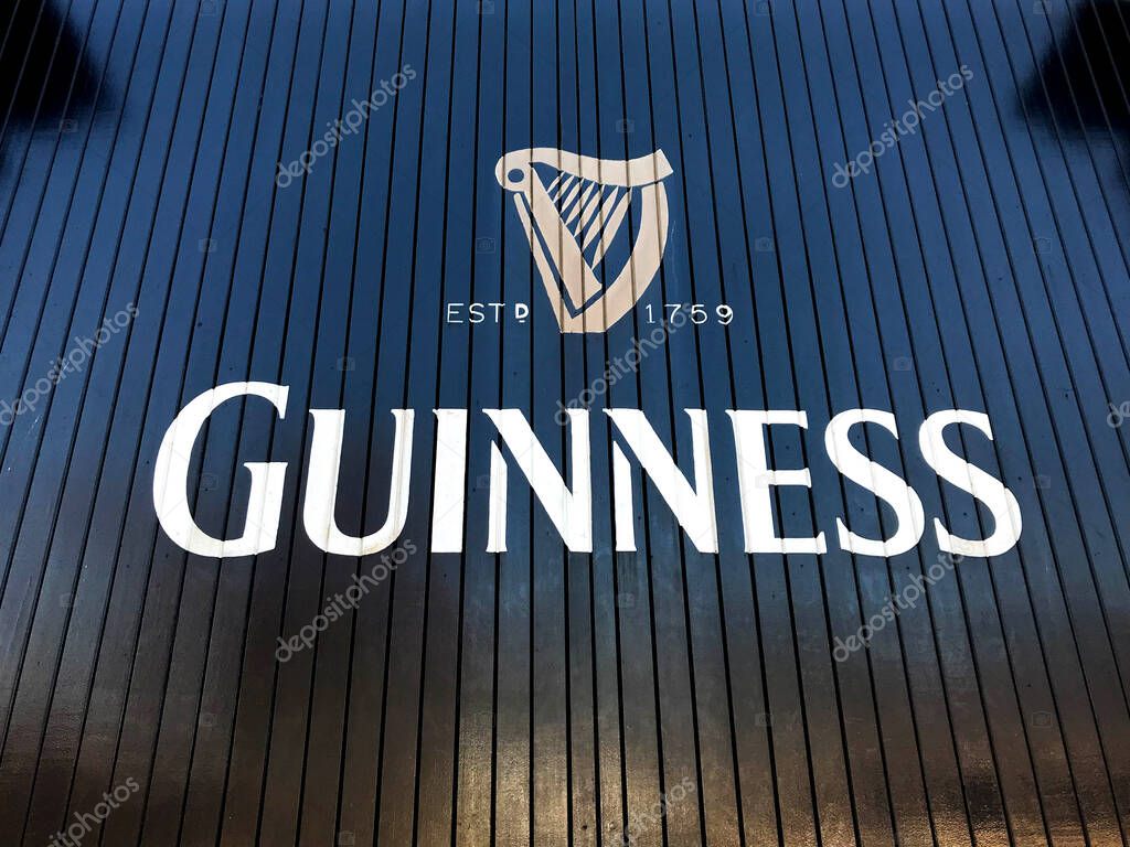Dublin, Ireland - February 2018: Logo on the wooden gates of the Guinness Brewery in Dublin. Its visitor centre is a major tourist attraction in the city