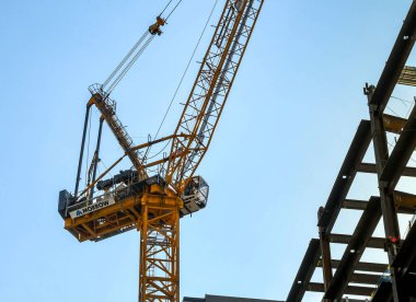 Seattle, Washington State, USA - June 2018: Tower crane working on a construction site in downtown Seattle.