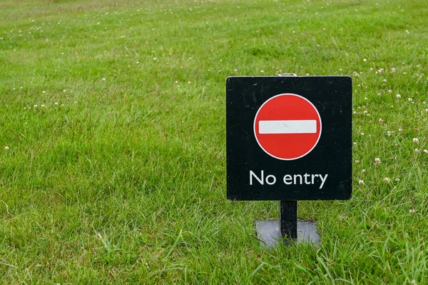 Entry Sign Standing Grass People Copy Space Left — Stock Photo, Image
