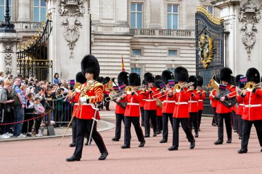 London, England - August 2021: Regimental band of the Welsh Guards marching from Buckingham Palace after the Changing of the Guard ceremony clipart