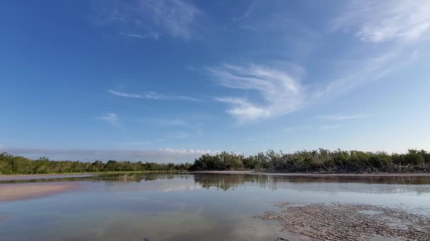 Timelapse of cloud formations over and reflect in Eco Pond in Everglades 4K. — стокове відео