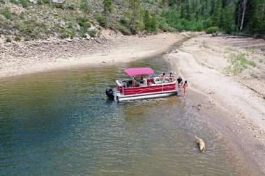 Aerial view of family and friends on pontoon boat on Lake Granby, Colorado. clipart