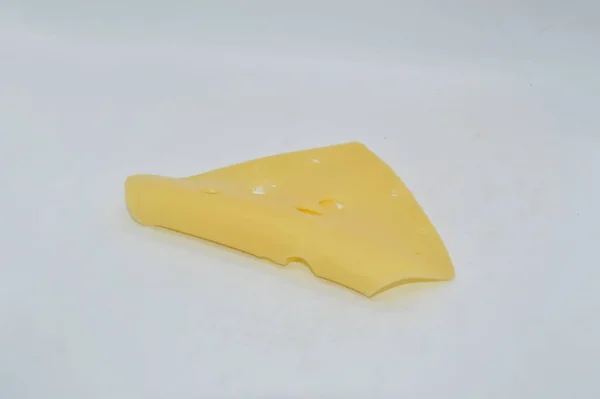 Gelber Käse Mit Löchern Auf Weißem Hintergrund — Stockfoto