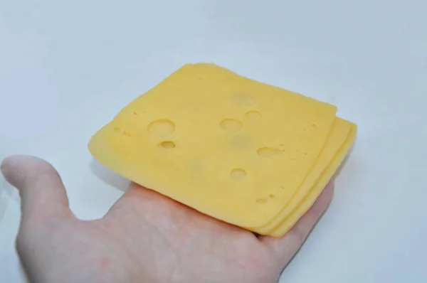 Beyaz Arkaplanda Delikleri Olan Sarı Peynir — Stok fotoğraf