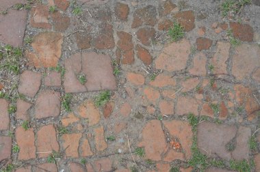 Texture of old masonry on a the road