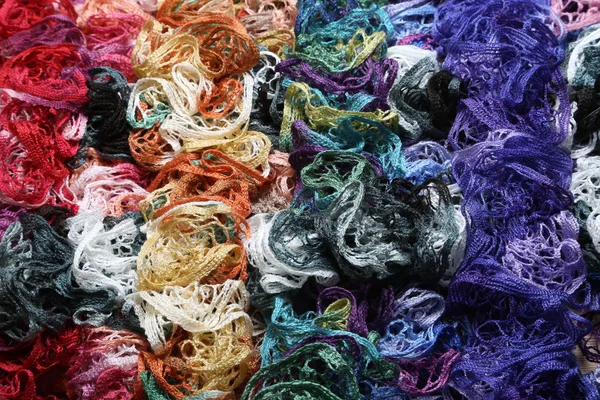 Many different colors in one place crocheted colored scarf — Stock Photo, Image