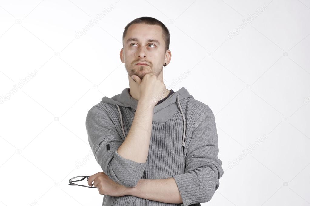 Thoughtful Man With Glasses in Hand