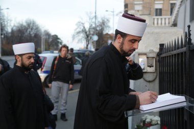 Representatives of the Islamic community in Belgrade Pay tribute to the victims in Paris clipart