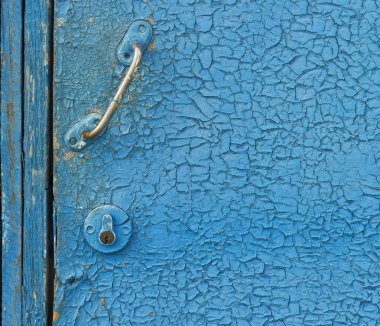 colored wall with cracks and handle