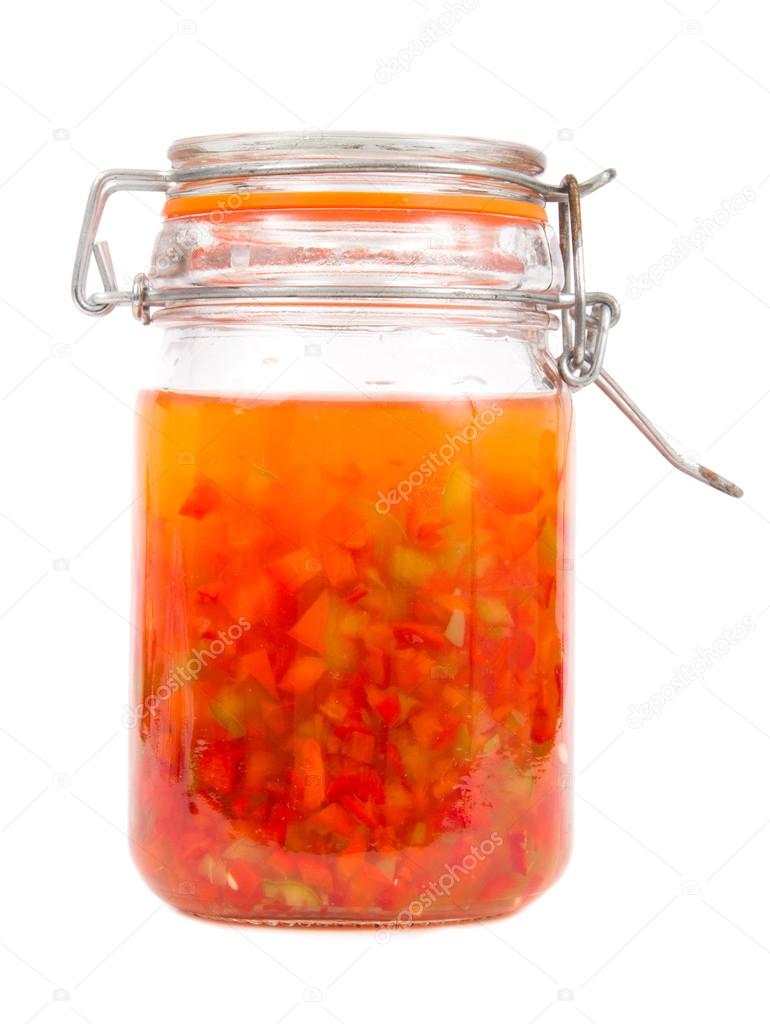 Hot pepper jelly preserving over white background