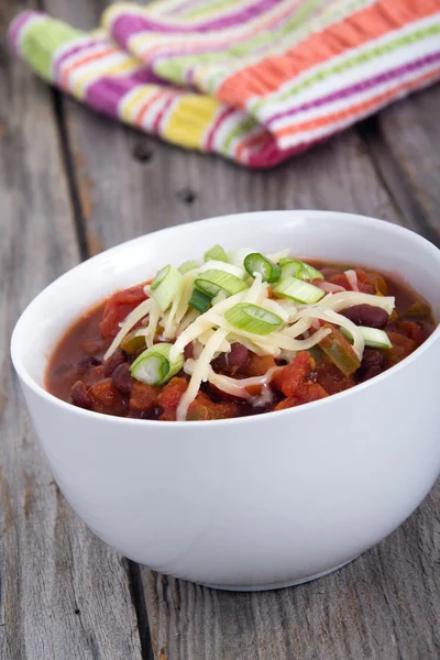 Chili topped with cheese and green onion — Stock Photo, Image