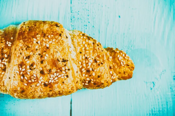 Croissant On Blue Table — Stock Photo, Image