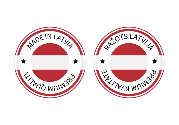 Made in Latvia round labels in English and in Latvian languages. Quality mark vector icon. Perfect for logo design, tags, badges, stickers, emblem, product package, etc — Stock Vector