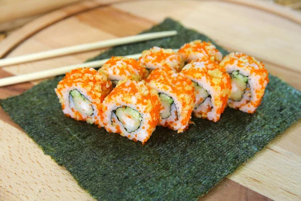 Japanese Sushi Roll Tempura Shrimp Cucumber Wrapped Rice Orange Flying — Stock Photo, Image