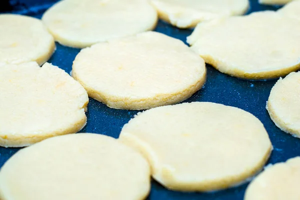 homemade cakes cheese cookies before baking on a baking sheet. High quality photo