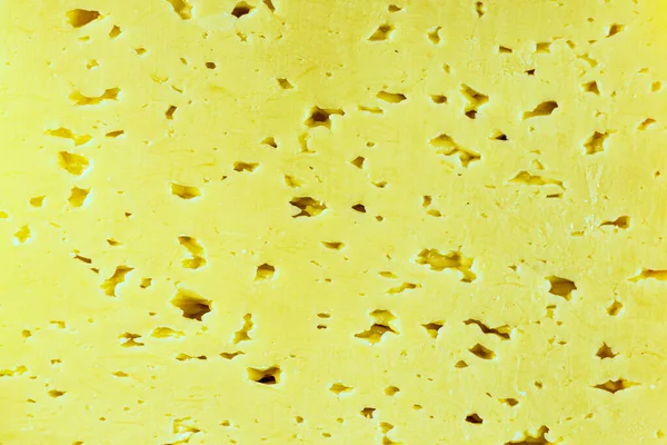 Gesneden Oppervlak Van Een Stuk Melk Natuurlijke Kaas Met Gaten — Stockfoto