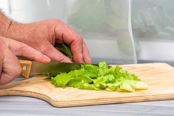 Cook Cuts Lettuce Leaves Wooden Chopping Board Knife High Quality — Stock Photo, Image