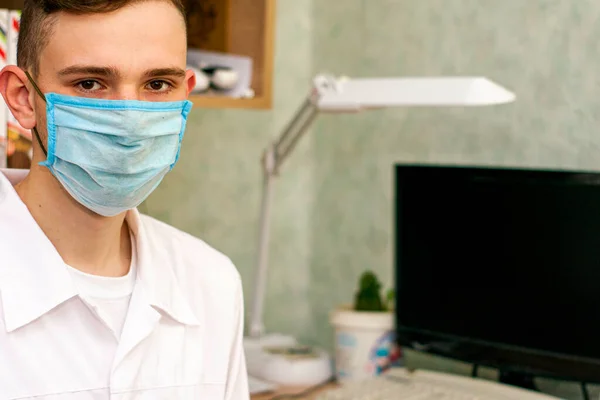 Young Doctor White Coat Protective Hygienic Mask His Office High — Stock Photo, Image