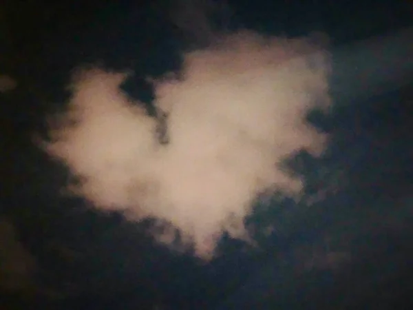 Cloud-shaped heart on a sky dark romantic