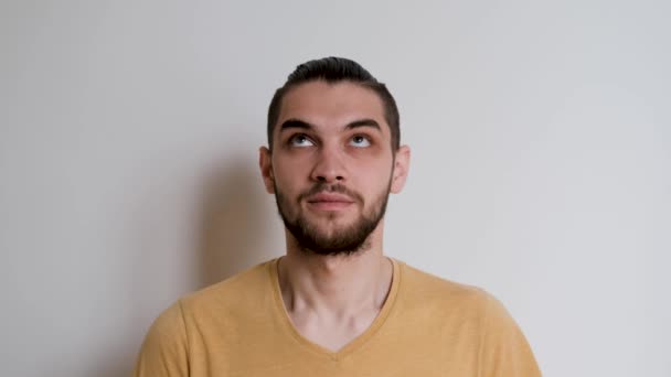 Human Yellow Tshirt White Studio Background Depicts Emotions Handsome Caucasian — Stock Video