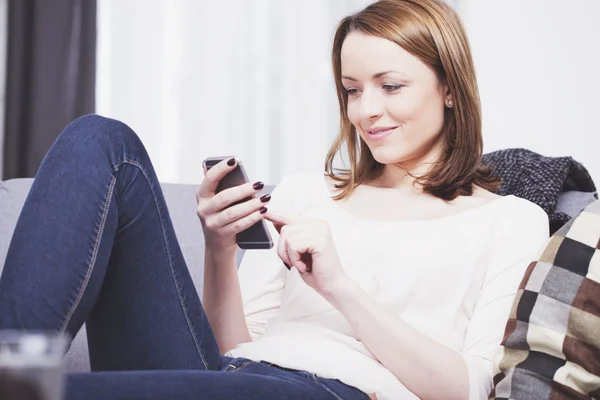 Young beautiful woman loves music with smart phone and headset — Stock Photo, Image