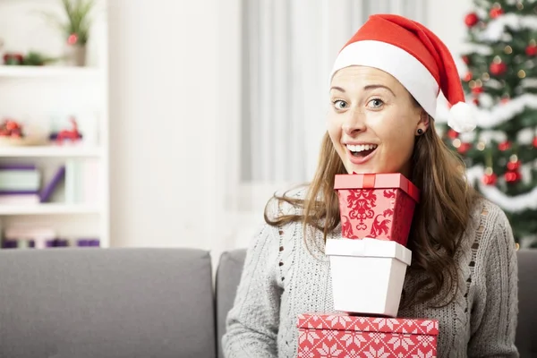 Young girl has a lot of presents for you — Stock Photo, Image