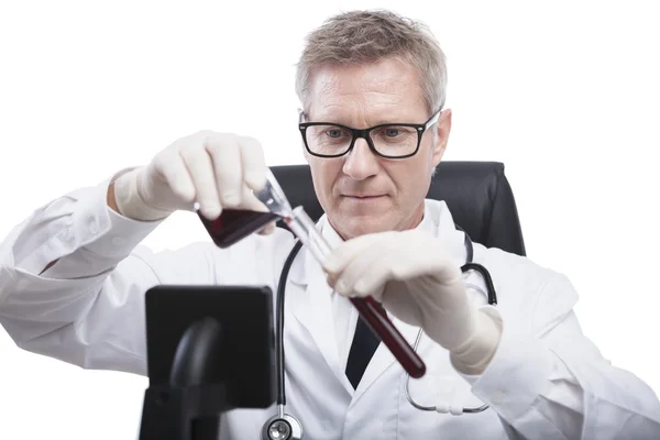 Doctor look and analyse blood test tube — Stock Photo, Image