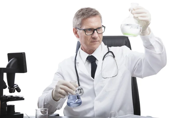 Doctor look and analyse liquid test tube — Stock Photo, Image