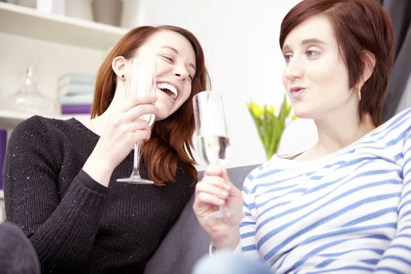 Two young girls with champagne — Stock Photo, Image