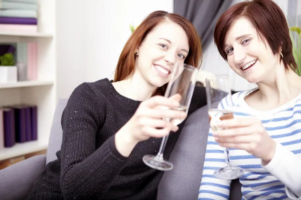 Two young girls with champagne — Stock Photo, Image