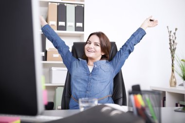 Happy Female Executive Stretching her Arms clipart