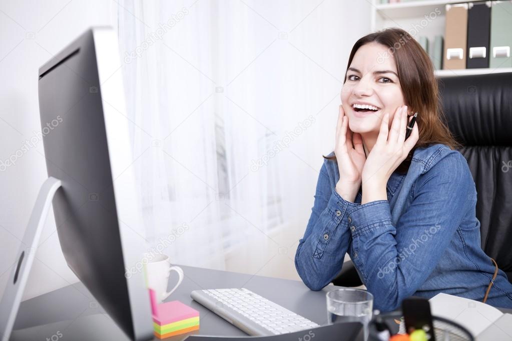 Office Woman Leaning on Table with Hands on Face