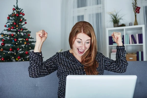 At christmas girl raise arms into the air — Stock Photo, Image