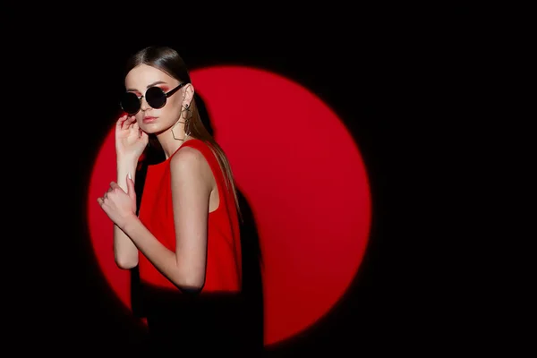 Fashion Portrait Young Woman Red Dress Sunglasses Red Background Spotlight — Stock Photo, Image
