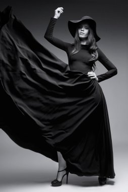 Bir şapka ve uzun Durian elbise zarif kadın