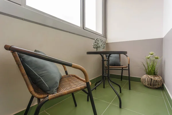 dinner tea table with chairs on the loggia in light interior