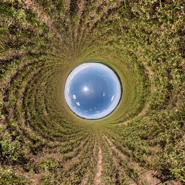 Blue little planet. Inversion of tiny planet transformation of spherical panorama 360 degrees. Spherical abstract aerial view. Curvature of space.