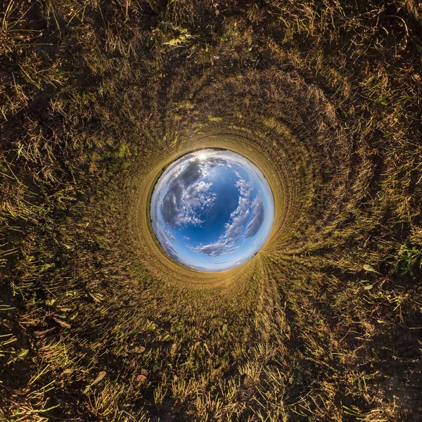 Blue little planet. Inversion of tiny planet transformation of spherical panorama 360 degrees. Spherical abstract aerial view. Curvature of space.