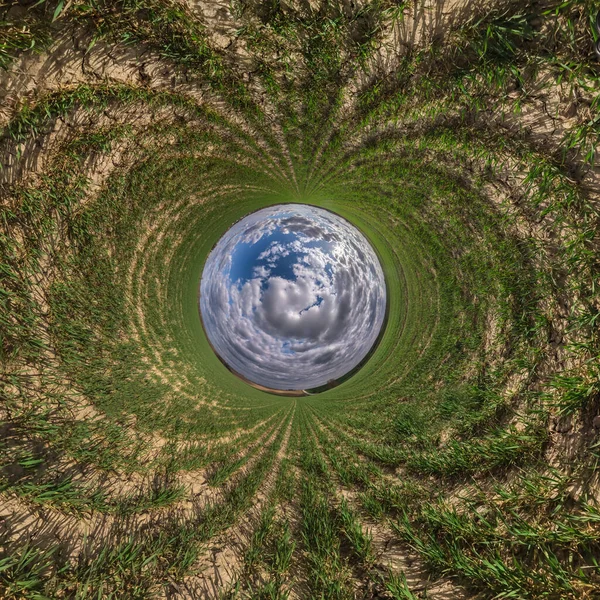 Blue little planet. Inversion of tiny planet transformation of spherical panorama 360 degrees. Spherical abstract aerial view. Curvature of space.