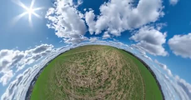 Green Little Planet Fast Revolves Beautiful Blue Sky White Clouds — Stockvideo