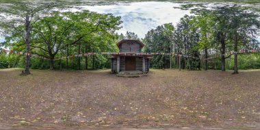 Full seamless spherical hdri panorama 360 degrees angle near wooden decorative pagan church in the forest in equirectangular spherical projection with zenith and nadir. vr content clipart