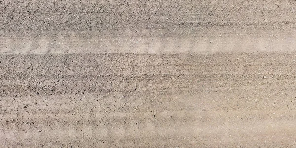 汽车轮胎轨道砾石路面上从上往下的道路全景 — 图库照片