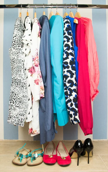 Different clothes on hangers close up — Stock Photo, Image