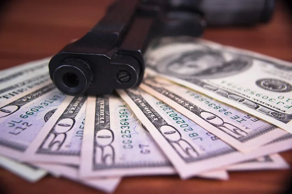 Gun, drugs and money on wooden background — Stock Photo, Image