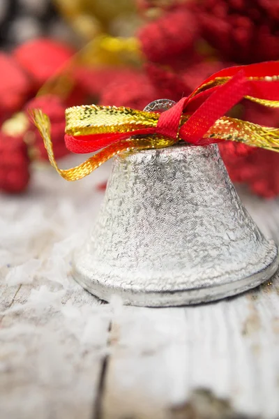 Jingle bell on wooden surface with copy space — Stock Photo, Image